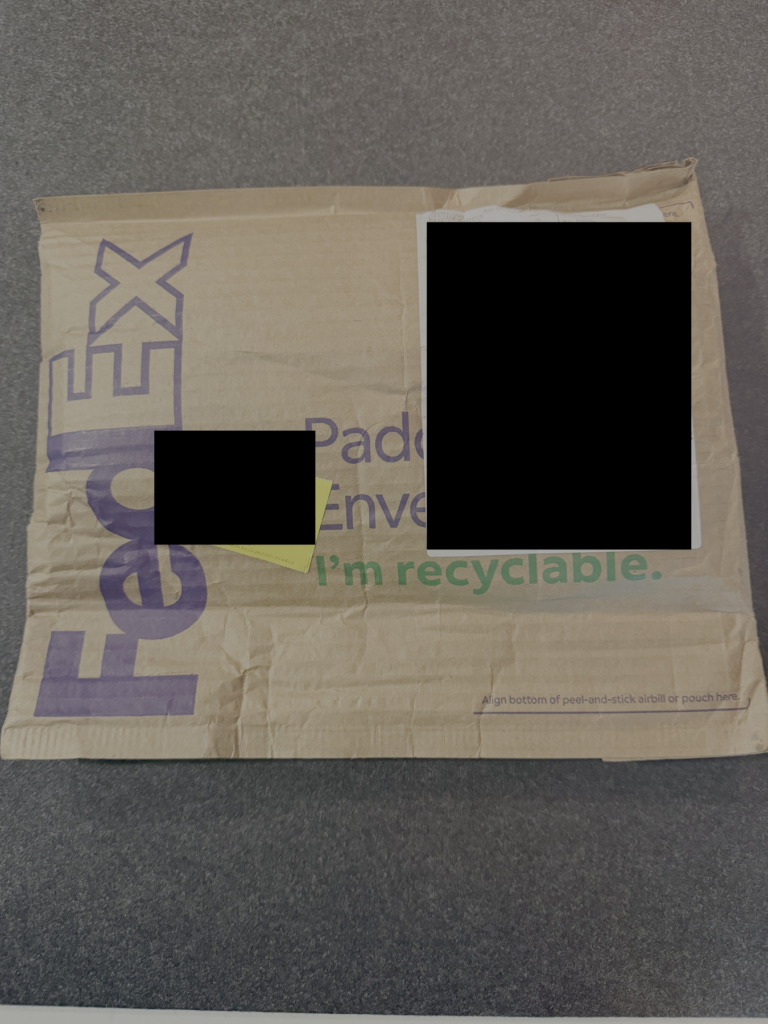 Package intake, photographed sealed before anything is opened